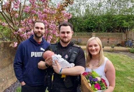 Baby Willow meeting PC Ronnie Barrett with parents Ollie and Abbey Clarke. Picture: Kent Police